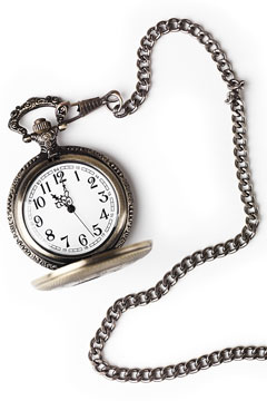 a vintage pocket watch and chain