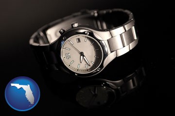 a wristwatch on a black background, with reflection - with Florida icon