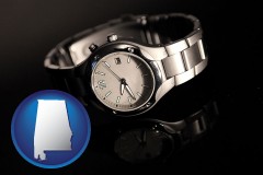 alabama map icon and a wristwatch on a black background, with reflection