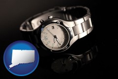 connecticut map icon and a wristwatch on a black background, with reflection