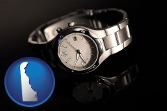 delaware map icon and a wristwatch on a black background, with reflection