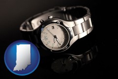 indiana map icon and a wristwatch on a black background, with reflection
