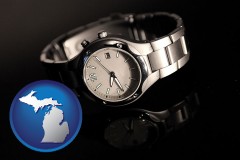 michigan map icon and a wristwatch on a black background, with reflection