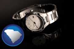 south-carolina map icon and a wristwatch on a black background, with reflection