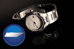 tennessee map icon and a wristwatch on a black background, with reflection