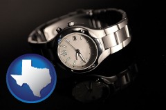 texas map icon and a wristwatch on a black background, with reflection
